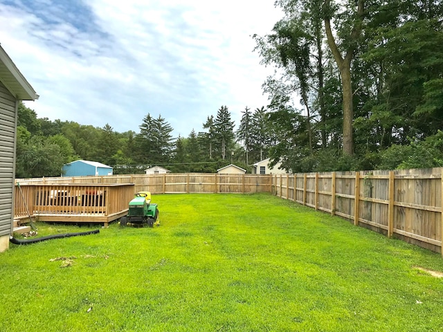 view of yard with a wooden deck