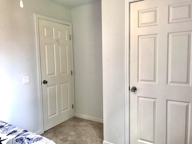 unfurnished bedroom featuring light colored carpet