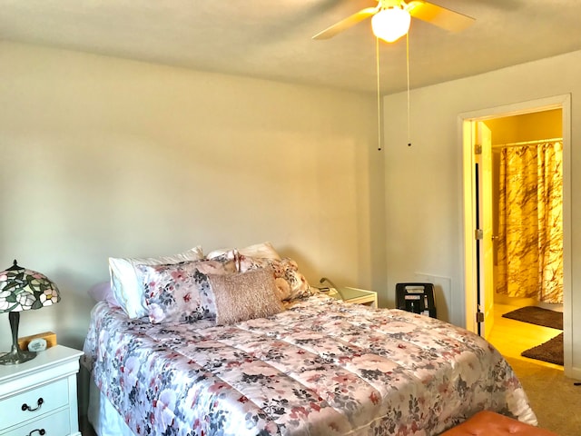 carpeted bedroom featuring connected bathroom and ceiling fan