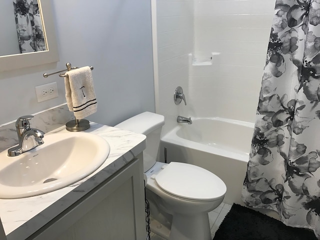 full bathroom featuring tile patterned flooring, shower / bath combination with curtain, vanity, and toilet