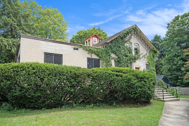 801 Portage Ave, Three Rivers, MI 49093 - view of front of property with a front yard and brick siding