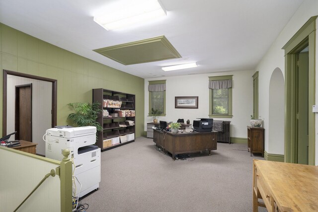 801 Portage Ave, Three Rivers, MI 49093 - office area featuring radiator, carpet flooring, and arched walkways
