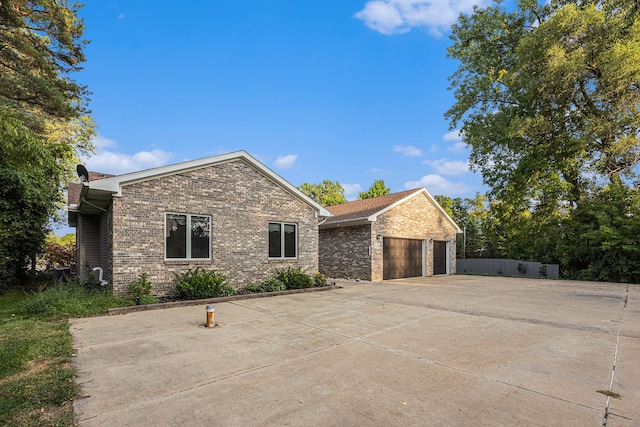 view of side of property featuring a garage