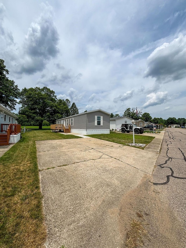 view of side of home featuring a lawn