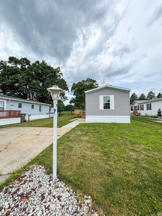 view of property exterior with a lawn