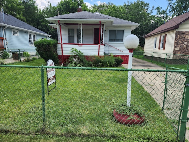 bungalow featuring a porch and a front yard