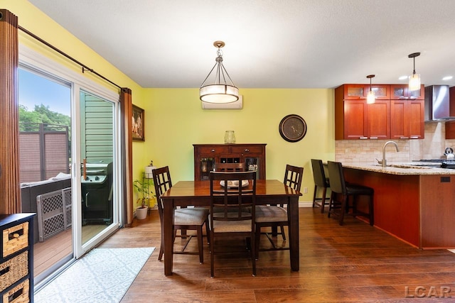 dining room featuring dark hardwood / wood-style flooring and sink