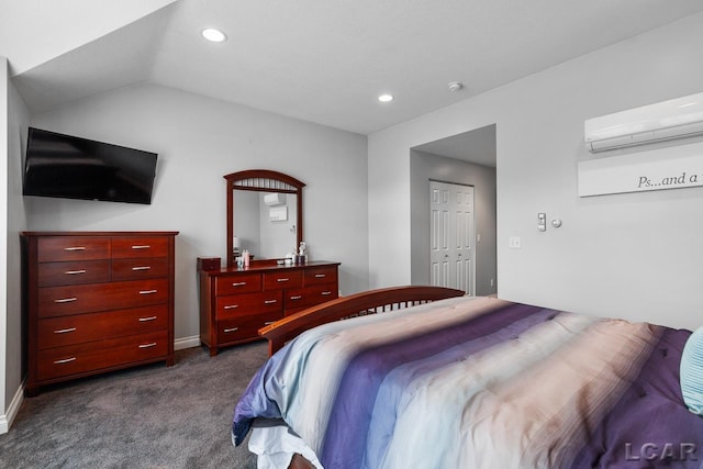 carpeted bedroom with a closet, lofted ceiling, and a wall mounted AC