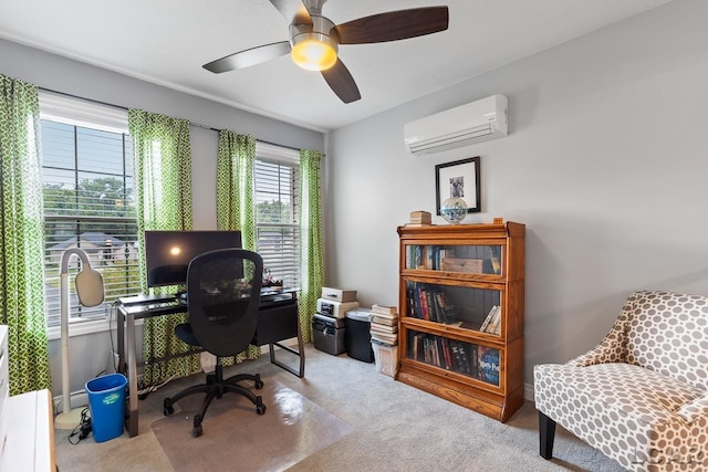 office space featuring light carpet, a wall unit AC, and ceiling fan