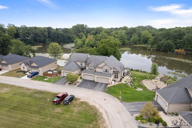 birds eye view of property with a water view