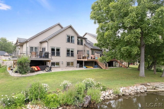 back of property featuring a deck with water view and a lawn