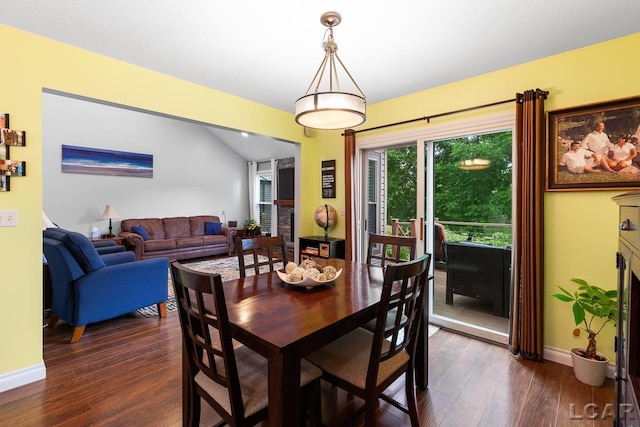 dining room with dark hardwood / wood-style flooring