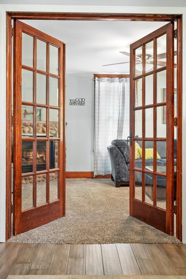 interior space with carpet flooring and french doors