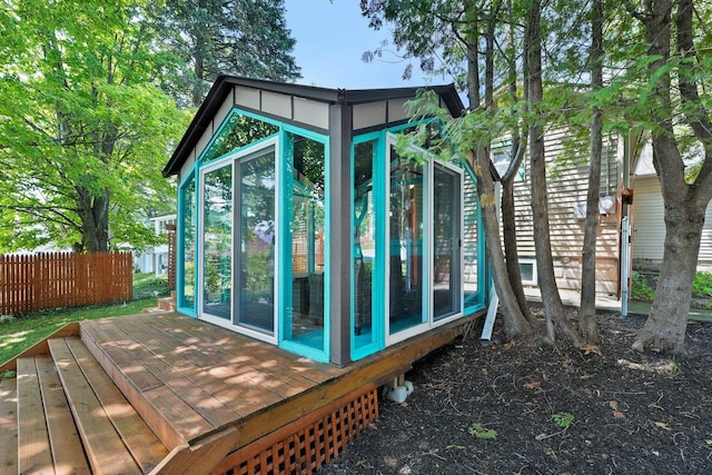 view of outdoor structure with a sunroom