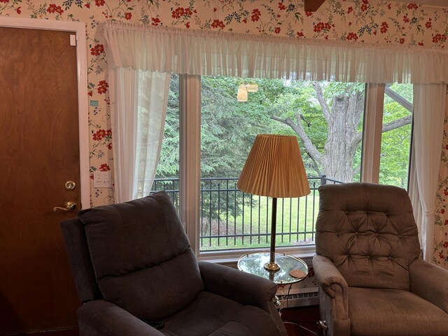 3447 200th Ave, Reed City, MI 49677 - living area featuring wallpapered walls and baseboard heating