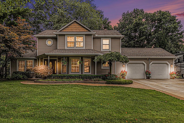 view of front of house with a lawn and a garage