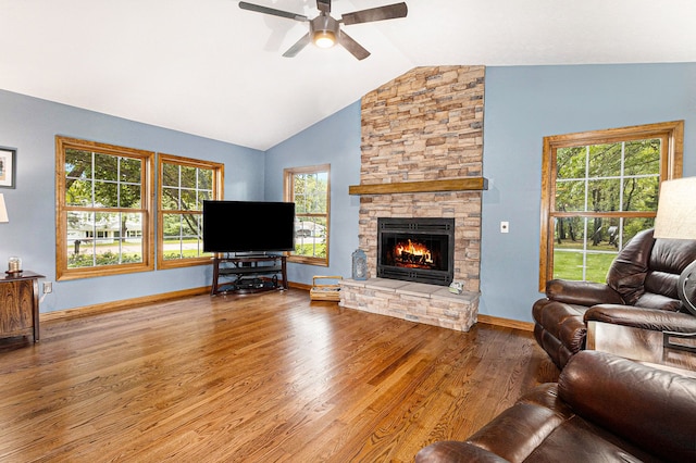 living room featuring hardwood / wood-style flooring, plenty of natural light, ceiling fan, and lofted ceiling