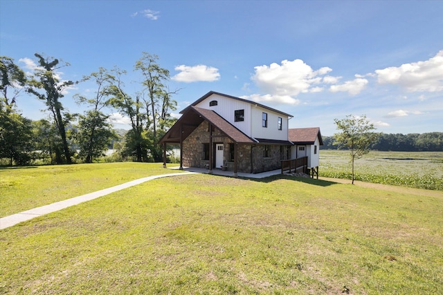 exterior space featuring a rural view and a yard