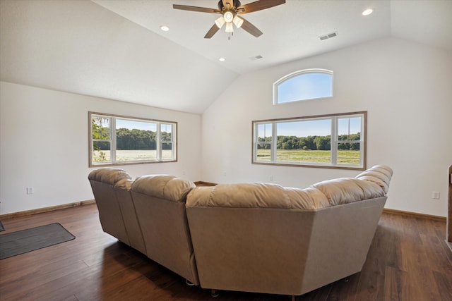 living room with plenty of natural light, ceiling fan, and dark hardwood / wood-style flooring