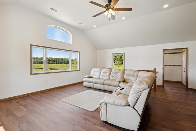 living room featuring high vaulted ceiling, ceiling fan, and dark wood-type flooring