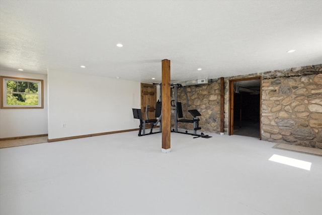 exercise room featuring carpet flooring and a textured ceiling