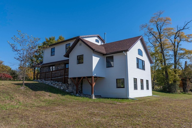 back of house with a yard