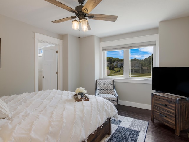 bedroom featuring ceiling fan and dark hardwood / wood-style flooring