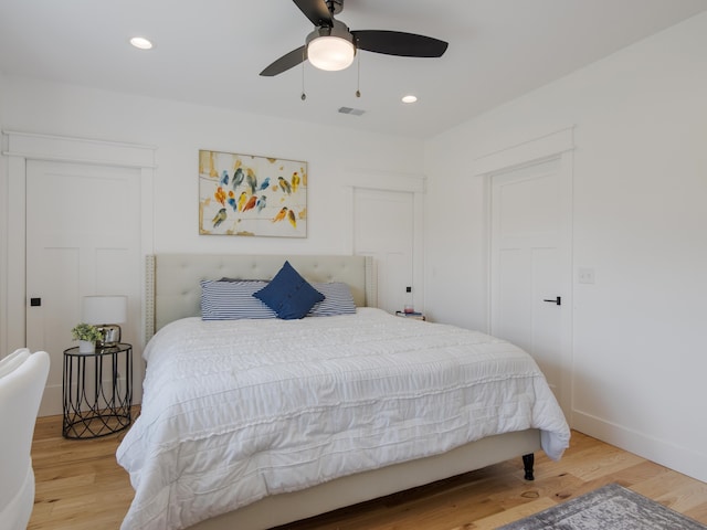 bedroom featuring light hardwood / wood-style floors and ceiling fan