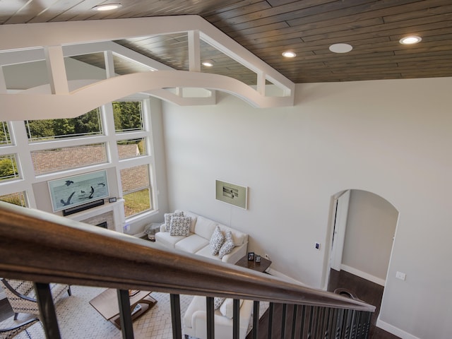 interior space with hardwood / wood-style floors, high vaulted ceiling, and wood ceiling