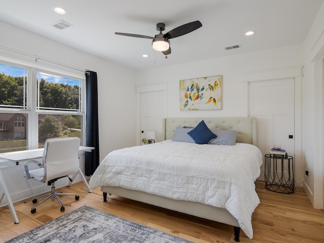 bedroom featuring hardwood / wood-style floors and ceiling fan