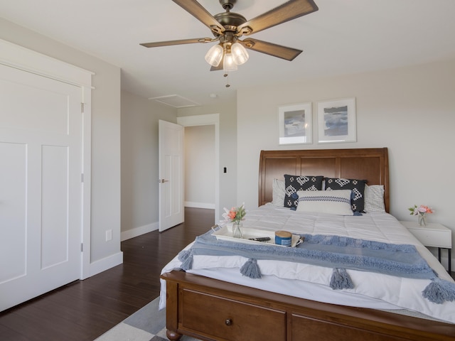 bedroom with ceiling fan and dark wood-type flooring