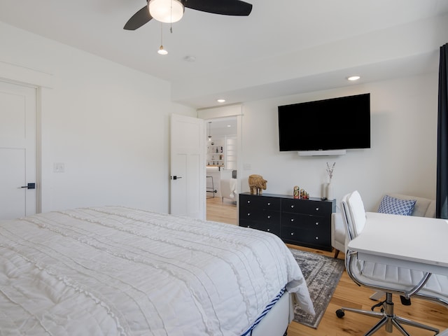 bedroom with ceiling fan and light hardwood / wood-style flooring