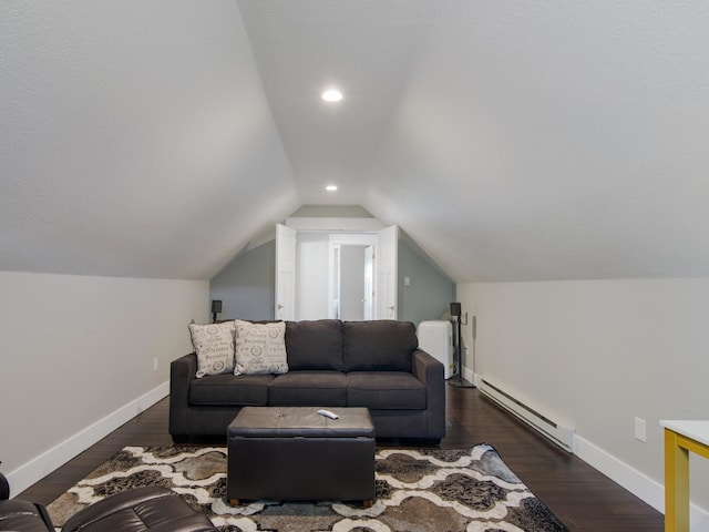 living room featuring dark hardwood / wood-style floors, lofted ceiling, and baseboard heating