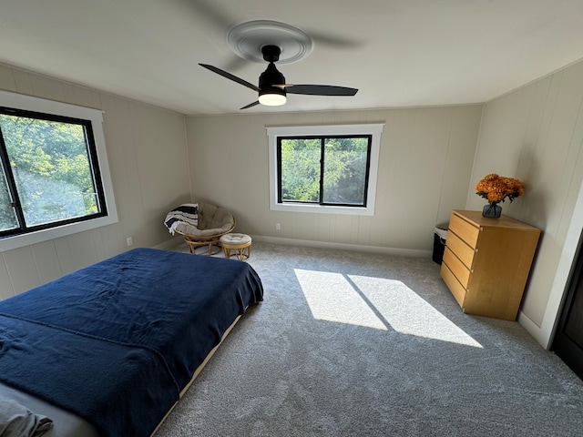 bedroom featuring light carpet and ceiling fan