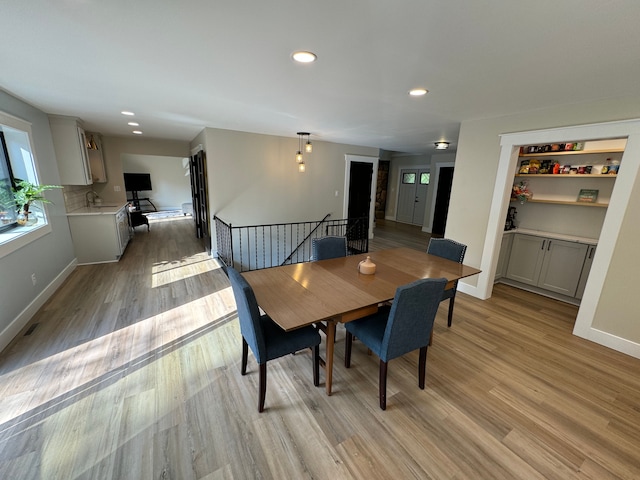 dining room featuring light hardwood / wood-style floors and sink