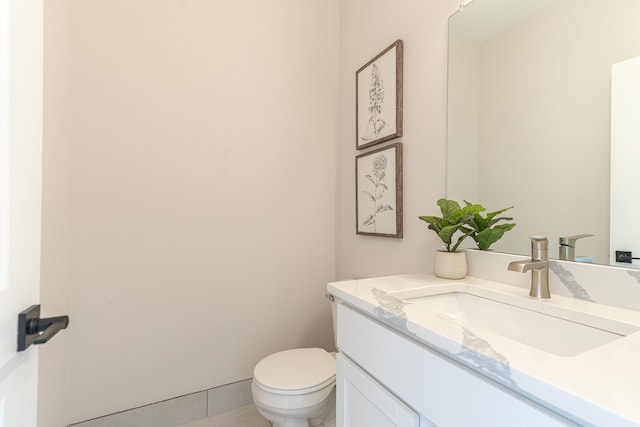 bathroom with vanity and toilet