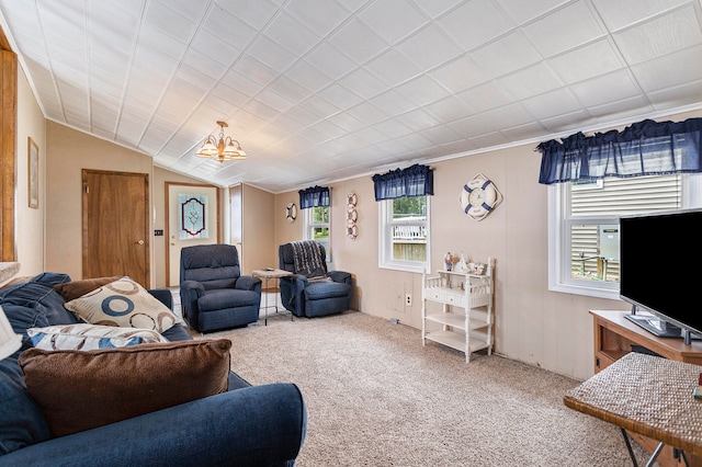 carpeted living room with an inviting chandelier and lofted ceiling