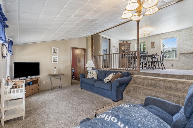 486 Maple Ln, Coldwater, MI 49036 - carpeted living area with a chandelier and lofted ceiling