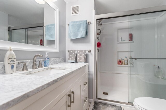486 Maple Ln, Coldwater, MI 49036 - full bathroom with vanity, a stall shower, and toilet