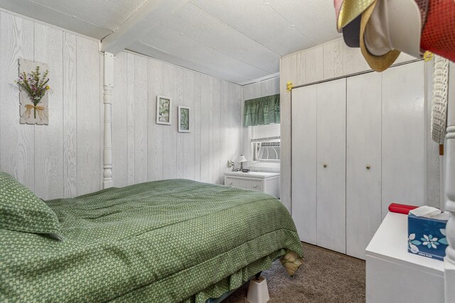 486 Maple Ln, Coldwater, MI 49036 - bedroom featuring carpet, wood walls, and a closet