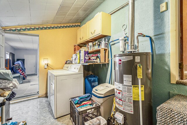486 Maple Ln, Coldwater, MI 49036 - washroom featuring water heater, cabinet space, and light tile patterned floors