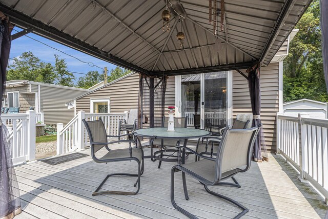 486 Maple Ln, Coldwater, MI 49036 - wooden terrace featuring a gazebo and outdoor dining space