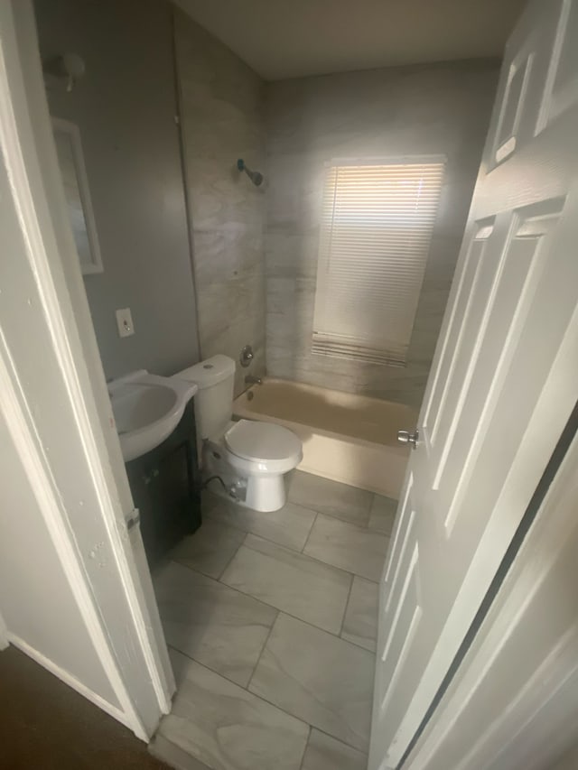 full bath with toilet, marble finish floor, shower / washtub combination, and vanity