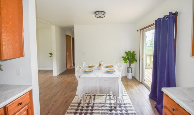 dining area with light hardwood / wood-style flooring