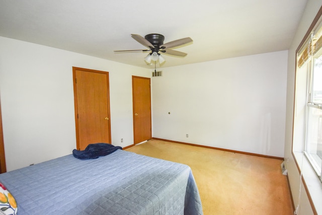 carpeted bedroom with ceiling fan