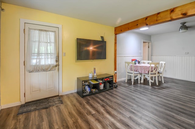 interior space featuring dark hardwood / wood-style floors and beam ceiling