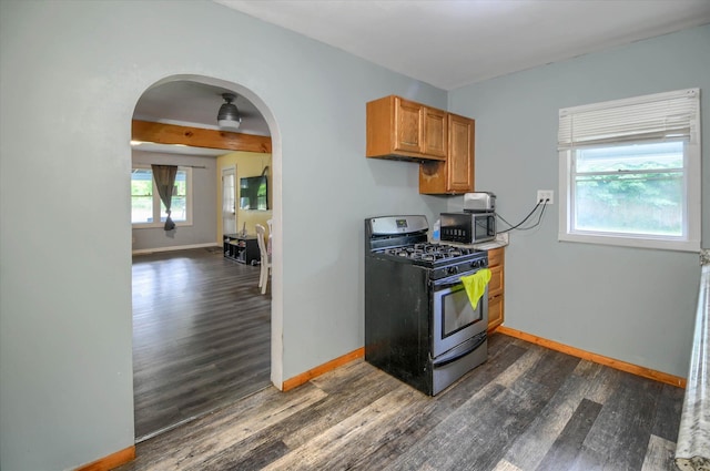 kitchen with range with gas stovetop and dark hardwood / wood-style flooring