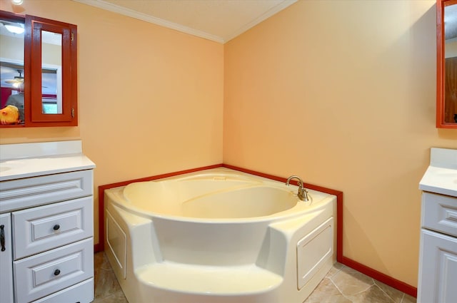 bathroom with tile patterned flooring, a bath, vanity, and crown molding