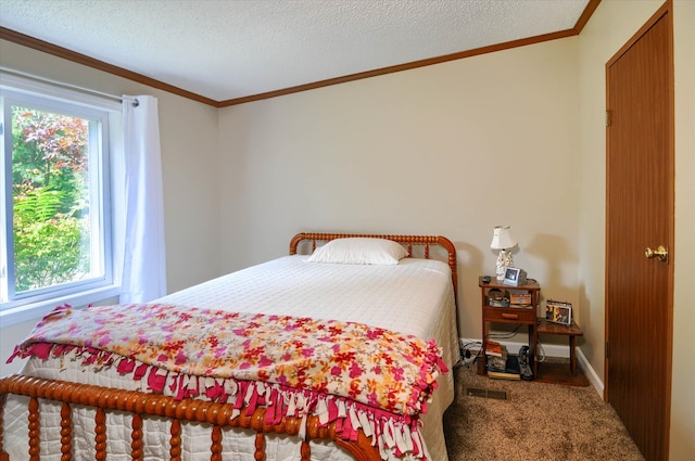 carpeted bedroom with a textured ceiling and ornamental molding