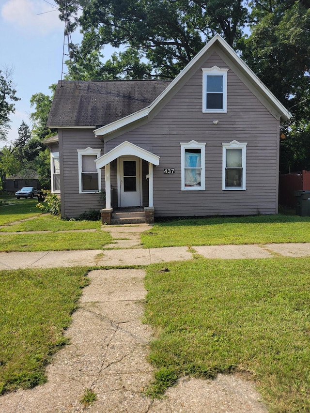 437 Ada Ave, Muskegon, MI 49442 - bungalow featuring a front yard